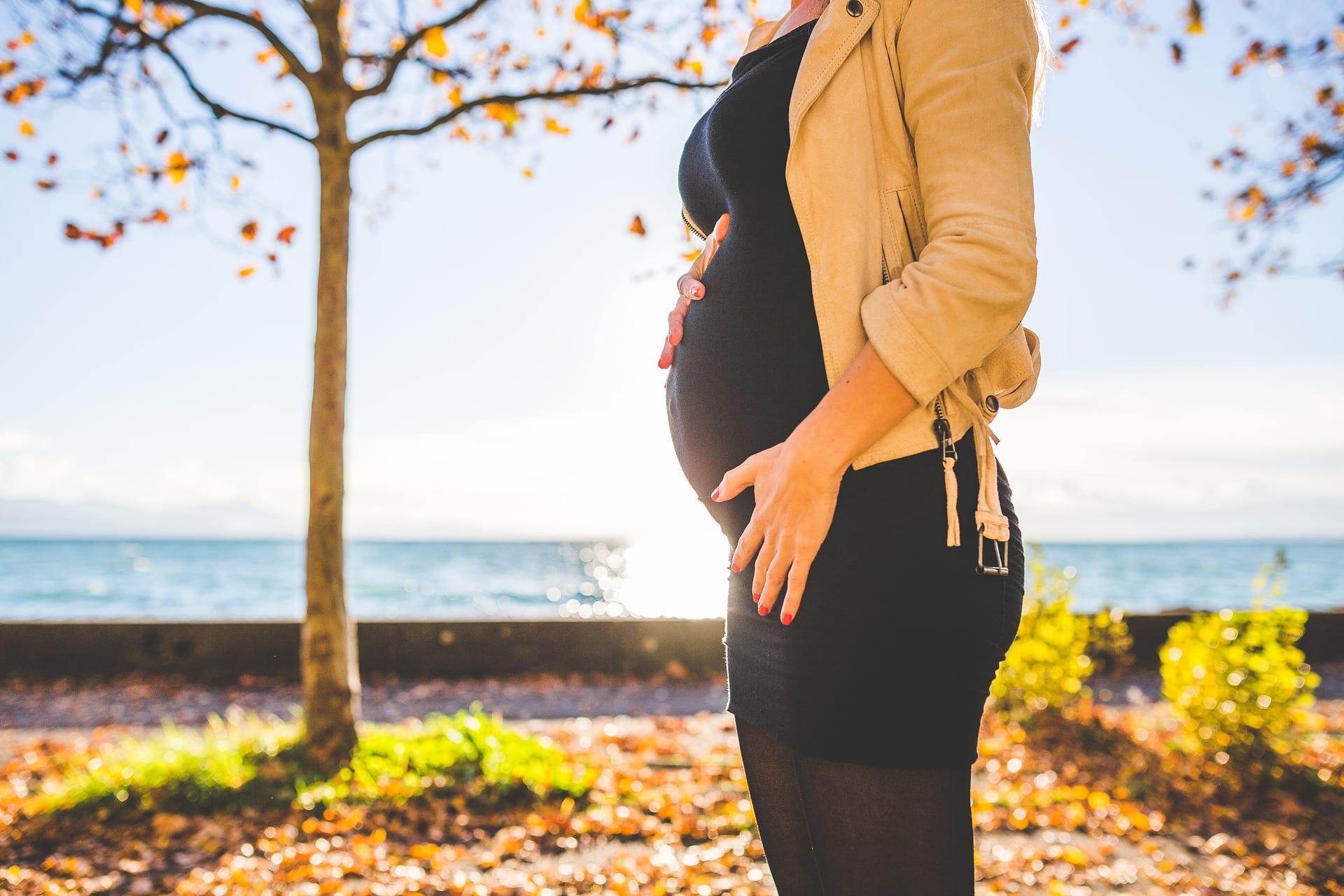 a pregnant woman in the sunshine.