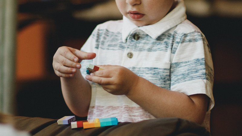 child playing with legos