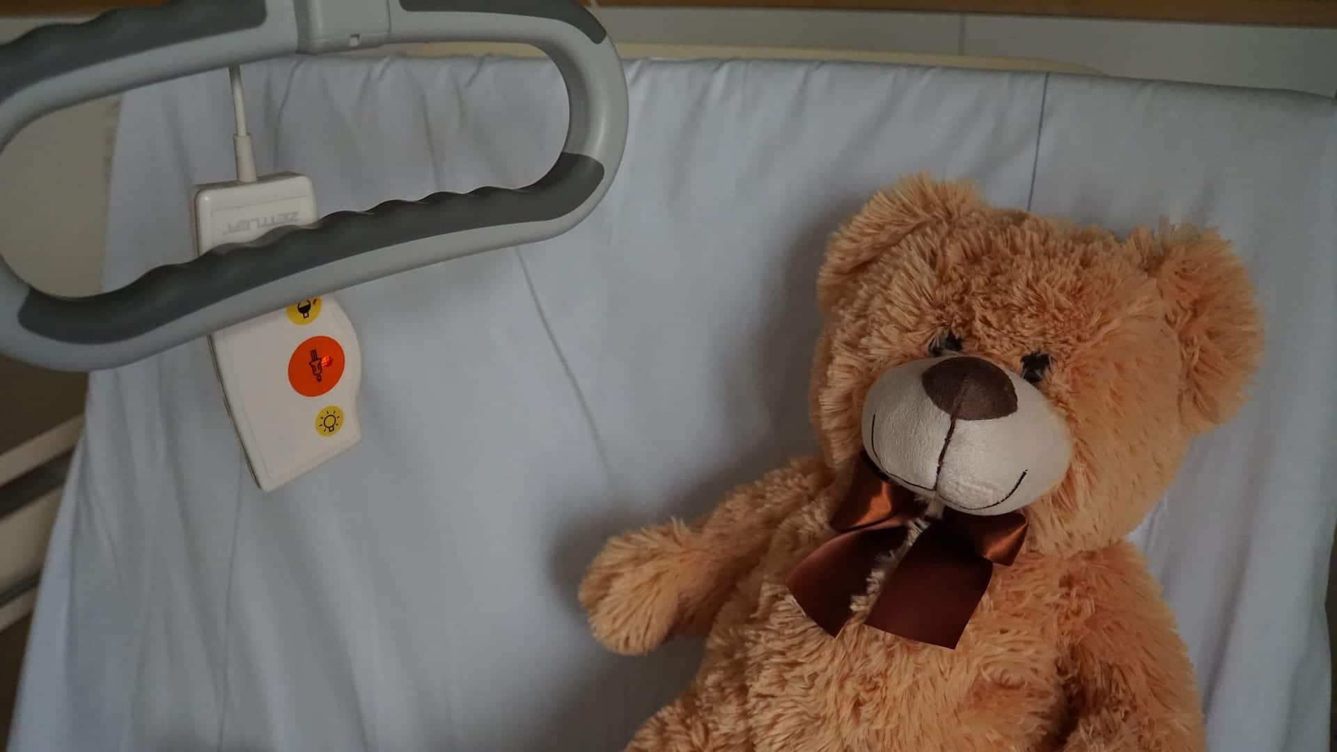 Teddy bear on hospital bed